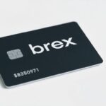 Brex credit card with logo on a clean surface.